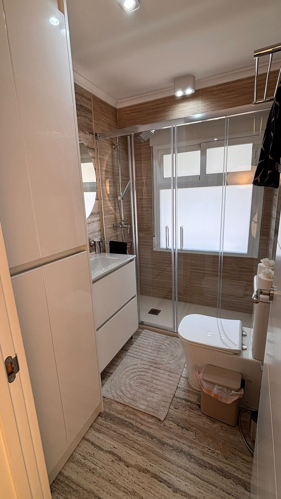 Second bathroom, white cabinets